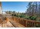 Wooden deck with wood railing overlooking a lush green wooded area at 813 Whittington Sw Pkwy, Marietta, GA 30060
