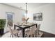 Dining room featuring modern table, chandelier, decorative rug and access to the back porch at 813 Whittington Sw Pkwy, Marietta, GA 30060