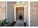 Close up of the front door of the townhome, with white pillars and brick surround at 813 Whittington Sw Pkwy, Marietta, GA 30060