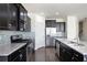 Well-equipped kitchen features stainless steel appliances, granite countertops and dark cabinets at 813 Whittington Sw Pkwy, Marietta, GA 30060