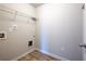 Clean laundry room with wire shelving and wood-look vinyl floors at 813 Whittington Sw Pkwy, Marietta, GA 30060