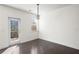 Bright living room with deck access, neutral paint, and elegant lighting fixture at 813 Whittington Sw Pkwy, Marietta, GA 30060