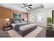 Spacious main bedroom with decorative accent wall, tray ceiling, and large bed at 813 Whittington Sw Pkwy, Marietta, GA 30060