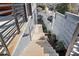 View of a well-maintained backyard with a staircase, modern fence, and fresh landscaping at 145 Hutchinson Ne St, Atlanta, GA 30307