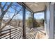 Spacious balcony features wood flooring, metal railings, and views of the surrounding neighborhood at 145 Hutchinson Ne St, Atlanta, GA 30307