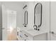Stylish bathroom boasts double vanities, sleek black fixtures, and modern design elements at 145 Hutchinson Ne St, Atlanta, GA 30307