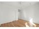 A bright bedroom with hardwood floors, fresh white walls, and ample natural light at 145 Hutchinson Ne St, Atlanta, GA 30307