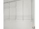 Bright closet with built-in white shelving and a hanging rod, perfect for organization at 145 Hutchinson Ne St, Atlanta, GA 30307