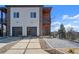 Contemporary home featuring gray siding, wood details, modern landscaping, and a two-car garage at 145 Hutchinson Ne St, Atlanta, GA 30307