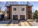 Stylish home boasting contemporary design, gray facade, two-car garage, and meticulous landscaping at 145 Hutchinson Ne St, Atlanta, GA 30307