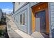 Stylish entrance with wooden accents, and stone steps leading to the front door of this modern home at 145 Hutchinson Ne St, Atlanta, GA 30307