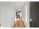 Bright hallway featuring hardwood floors, white walls, natural light, and modern design at 145 Hutchinson Ne St, Atlanta, GA 30307