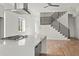 Modern kitchen with quartz counters, stainless steel appliances, and hardwood floors at 145 Hutchinson Ne St, Atlanta, GA 30307