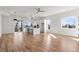 Bright and airy living room showcasing an open-concept layout with a modern kitchen and hardwood floors at 145 Hutchinson Ne St, Atlanta, GA 30307