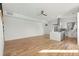 Bright open concept living room and kitchen with hardwood floors and modern appliances at 145 Hutchinson Ne St, Atlanta, GA 30307