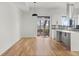 Open living space with hardwood floors, modern lighting, and a view of the outdoor scenery at 145 Hutchinson Ne St, Atlanta, GA 30307