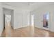 Bright main bedroom features hardwood floors, ensuite bathroom, and a ceiling fan at 145 Hutchinson Ne St, Atlanta, GA 30307