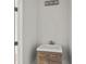 Contemporary powder room with wood vanity, modern sink, and minimalist design at 145 Hutchinson Ne St, Atlanta, GA 30307