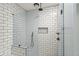 Modern shower design showcases subway tile surround with built-in niche and sleek fixtures at 145 Hutchinson Ne St, Atlanta, GA 30307