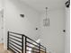 A staircase is visible in the house with a lamp hanging on the wall at 145 Hutchinson Ne St, Atlanta, GA 30307
