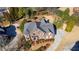 A captivating aerial view of an expansive home with lush landscaping and a large driveway at 155 Saddleview Run, Atlanta, GA 30350