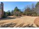 Large backyard with mature trees and shrubs at 155 Saddleview Run, Atlanta, GA 30350