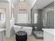 Bright bathroom featuring a soaking tub, glass enclosed shower, and modern fixtures at 155 Saddleview Run, Atlanta, GA 30350