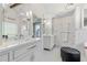 Bright bathroom with double sink vanity, quartz counters, and stylish lighting at 155 Saddleview Run, Atlanta, GA 30350