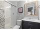 Bathroom with a glass shower door, white vanity with marble countertop, and framed mirror at 155 Saddleview Run, Atlanta, GA 30350