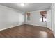 Bright bedroom with hardwood floors, neutral paint, and natural light from two windows at 155 Saddleview Run, Atlanta, GA 30350