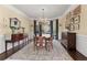Formal dining room with hardwood floors, a chandelier, and ample space for entertaining at 155 Saddleview Run, Atlanta, GA 30350