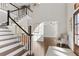 Elegant foyer with a staircase, hardwood floors, and an abundance of natural light at 155 Saddleview Run, Atlanta, GA 30350