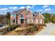 Stunning two-story brick home with a meticulously landscaped front yard and a welcoming entrance at 155 Saddleview Run, Atlanta, GA 30350