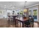 Open kitchen with white cabinetry, granite countertops, stainless steel appliances, and an adjacent dining area at 155 Saddleview Run, Atlanta, GA 30350
