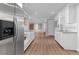 Modern kitchenette features white cabinets, granite countertops, and stainless steel refrigerator at 155 Saddleview Run, Atlanta, GA 30350