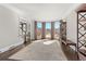 Light-filled living room featuring large windows, hardwood floors, and elegant trim work at 155 Saddleview Run, Atlanta, GA 30350