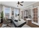 Bright home office with large windows, a ceiling fan, and stylish French doors at 155 Saddleview Run, Atlanta, GA 30350
