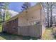 Back of red brick house with covered patio and large concrete wall and pillar at 1753 Dodson Sw Dr, Atlanta, GA 30311