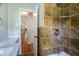 Shower stall with tiled walls and shower head, and long hallway view at 1753 Dodson Sw Dr, Atlanta, GA 30311