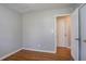 Bedroom features hardwood floors, neutral walls, and closet at 1753 Dodson Sw Dr, Atlanta, GA 30311