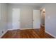 Bedroom features hardwood floors, neutral walls, and closet at 1753 Dodson Sw Dr, Atlanta, GA 30311