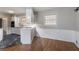 Dining area features hardwood floors and view of the kitchen with tile floors at 1753 Dodson Sw Dr, Atlanta, GA 30311