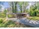 Cozy single story home featuring covered parking, a brick facade, and a well-maintained yard at 1753 Dodson Sw Dr, Atlanta, GA 30311