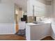 Kitchen area with cooktop on breakfast bar, view to dining area at 1753 Dodson Sw Dr, Atlanta, GA 30311