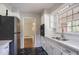 Kitchen features stainless appliances, tile backsplash, and black and white flooring at 1753 Dodson Sw Dr, Atlanta, GA 30311