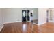 Inviting living room with hardwood floors, a mirrored wall, and access to other rooms at 1753 Dodson Sw Dr, Atlanta, GA 30311