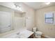 Bright bathroom with a large mirror and a window at 5232 Centennial Hill Nw Dr, Acworth, GA 30102