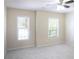 This bedroom features plush gray carpet and two bright windows at 5232 Centennial Hill Nw Dr, Acworth, GA 30102