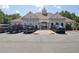 A clubhouse surrounded by a parking lot with several cars at 5232 Centennial Hill Nw Dr, Acworth, GA 30102