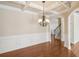 Dining room with hardwood floors, chair rail molding, and a stylish chandelier at 5232 Centennial Hill Nw Dr, Acworth, GA 30102